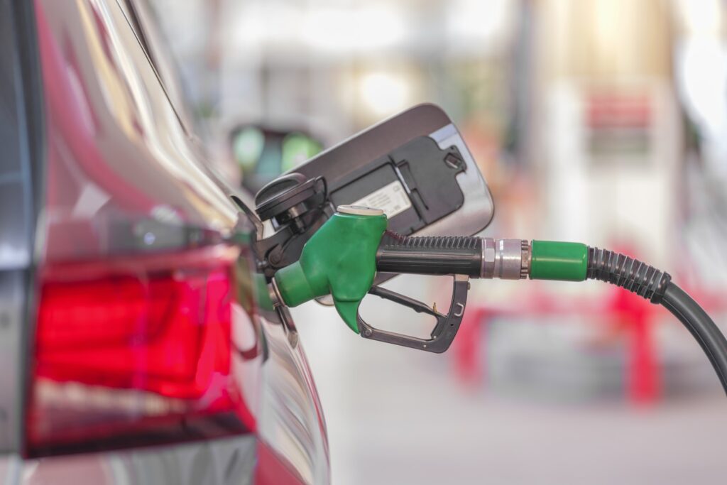 Pumping gas at gas pump
