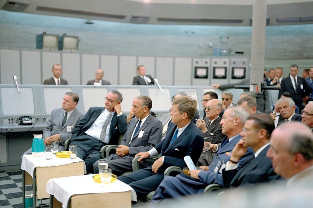 President John F. Kennedy receives a briefing by Major Rocco Petrone at the Cape Canaveral Missile Test Annex