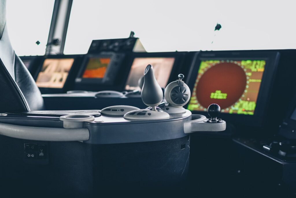 Control panel, joystick, screen and buttons of a cruise ferry in the cockpit.