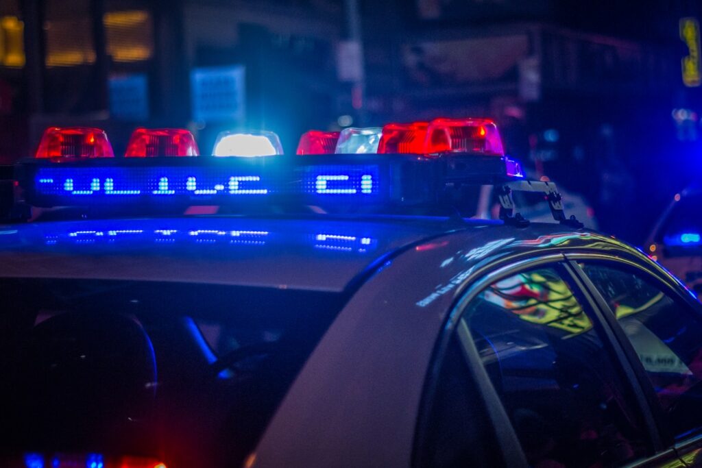 blue car on the street during night time