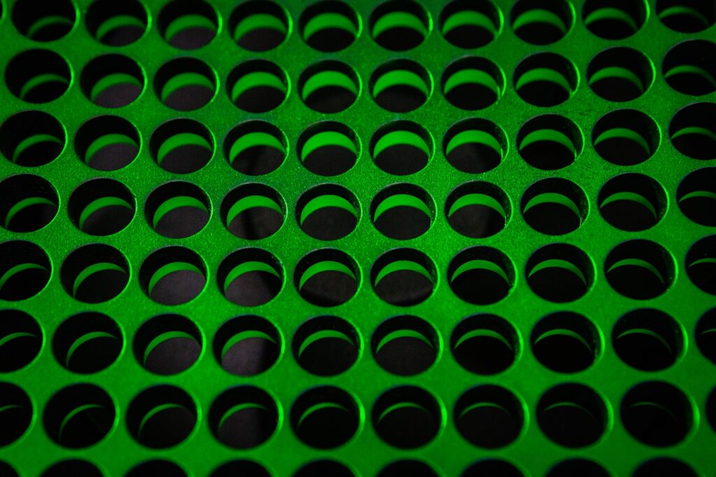 green and black polka dot textile