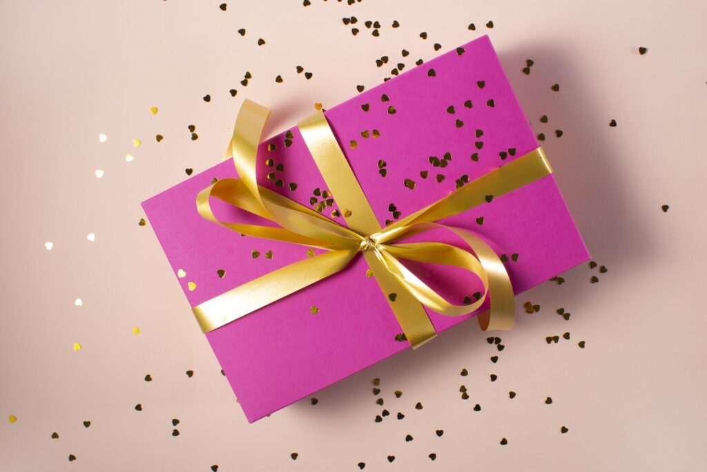 pink gift box with yellow ribbon